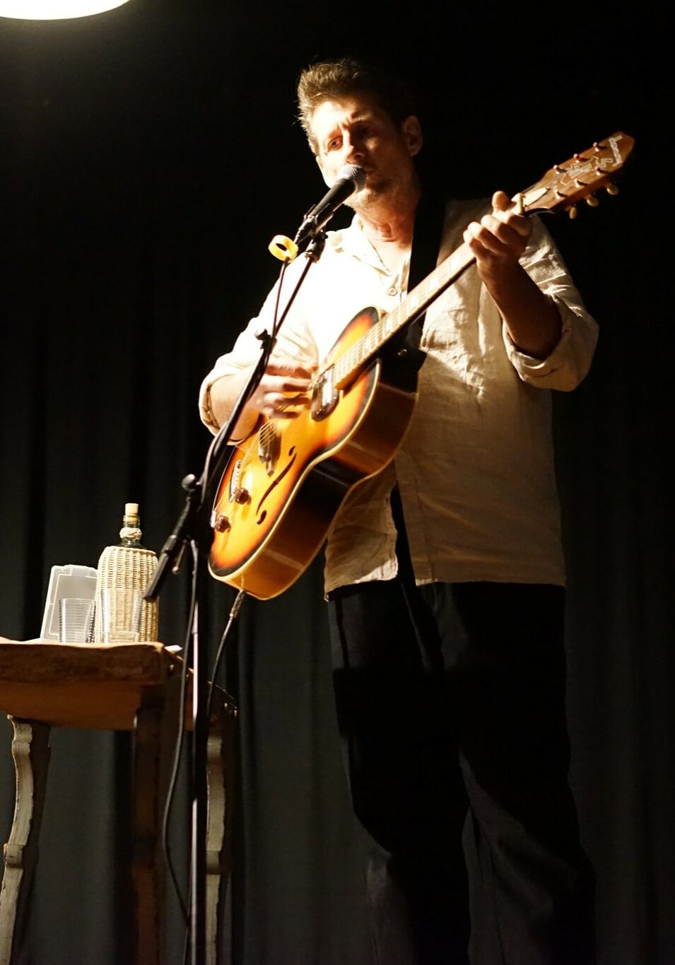 Singer-songwriter Jimmy Dowling performing live with acoustic guitar at Tintenbar Up Front community event in Northern NSW
