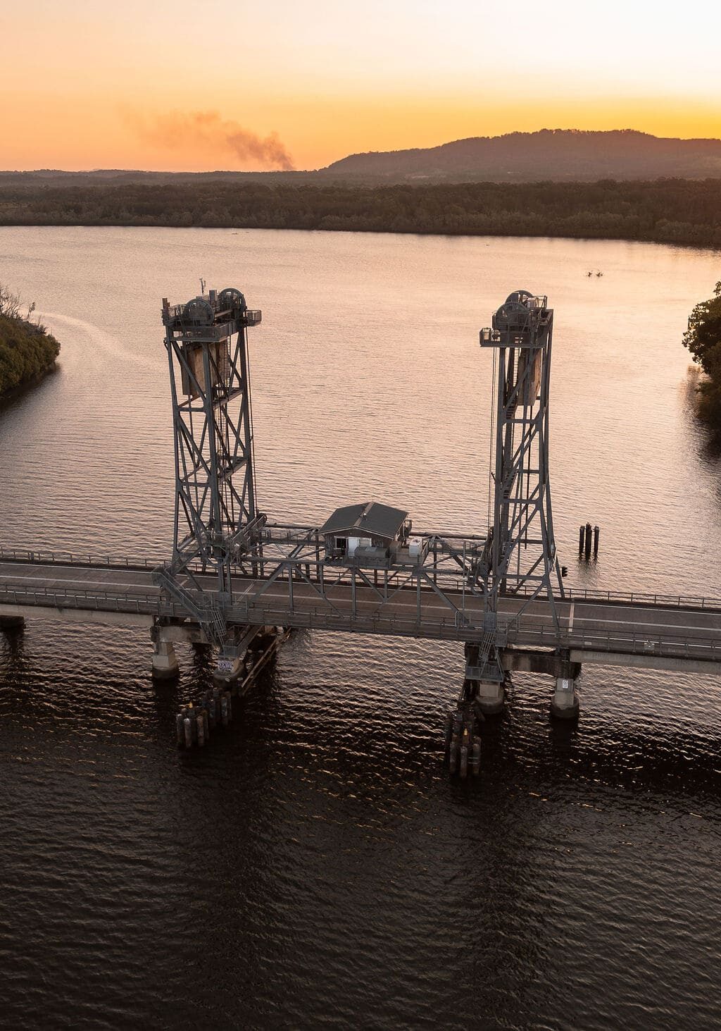 Wardell Bridge at sunset spanning the Richmond River in northern New South Wales, framed by mangroves and golden sky